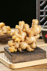 Fresh Guangxi Ginger Root on Wooden Board - Yellow Organic Spice for Cooking and Natural Medicine