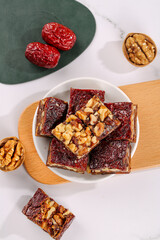 Xinjiang Date Walnut Squares with Red Jujube Traditional Chinese Healthy Snack Bars on Marble Background