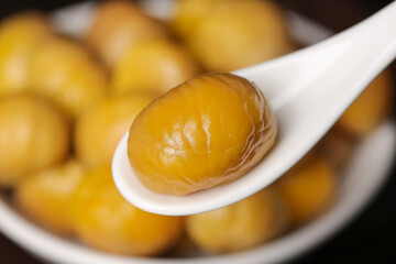 Sweet Glazed Chestnuts on Spoon - Traditional Asian Snack Food