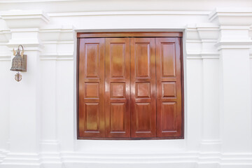 Wood window brown background on white concrete wall