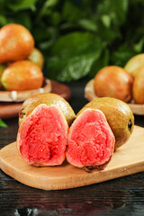 Fresh Red Guava Fruit from Guangxi with Heart-Shaped Pink Flesh Display on Wooden Board