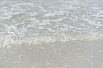 Gentle Ocean Waves Lapping on Soft Sandy Shoreline in a Calm Seascape with Beautiful Textures and Serenity of Nature at the Beach
