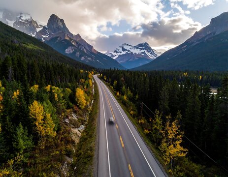 High-angle view of a road winding through autumnal mountain scenery