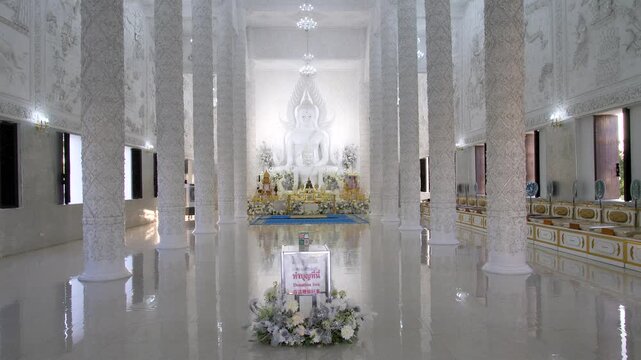 Serene interior of Temple Wat Huay Pla Kang with white pillars