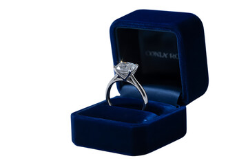 Luxurious diamond engagement ring presented in elegant blue velvet jewelry box isolated on transparent background