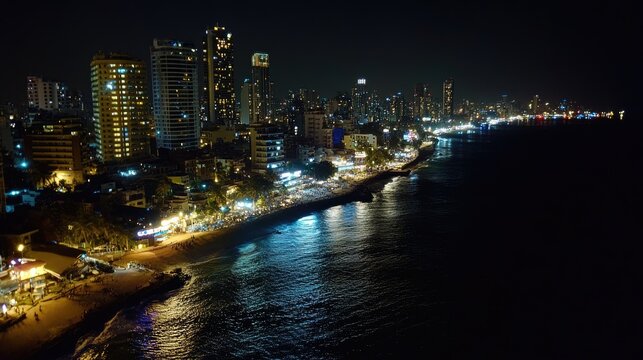 Night cityscape by the sea, illuminated buildings - Powered by Adobe