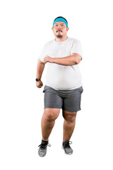 Confident Man with a Blue Headband Jogging in a Studio
