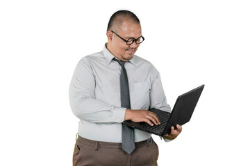 Smiling and Confident Asian Business Man Working on a Laptop