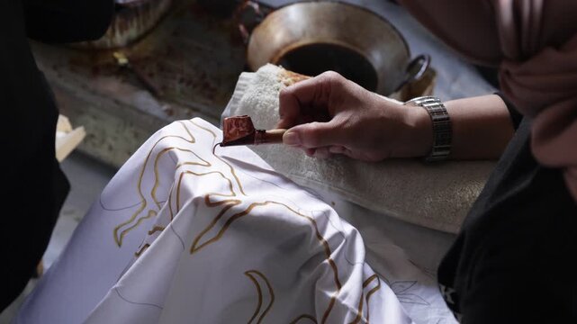 The process of making batik from Indonesia. Handcrafted artwork and one of the country's heritage. Canting process. 4k batik 
