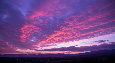 Fototapeta premium Vibrant hues paint the evening sky with stunning sunset clouds