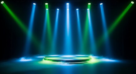 A circular stage with green and blue spotlights shining down on it in a dark room, creating a dramatic atmosphere for a performance or event