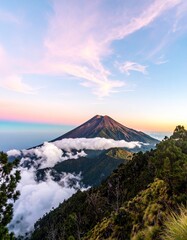 Fototapeta premium Volcanic peak at sunset, clouds