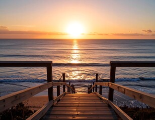Obraz premium Sunrise over the ocean, wooden pathway to the shore