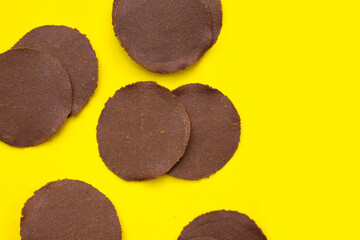 Fermented soybean discs, known as “Thua Nao,” a traditional Thai seasoning used to enhance flavor in Northern cuisine.