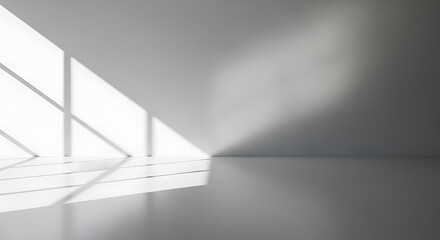 Obraz premium Sunlight casting geometric shadows in a modern empty room