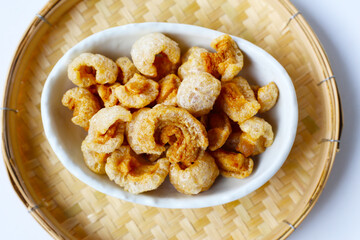 Crispy pork cracklings, a crunchy savory snack.