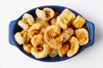 Crispy pork cracklings, a crunchy savory snack.