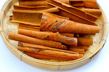 Dried cinnamon sticks arranged in a bundle.