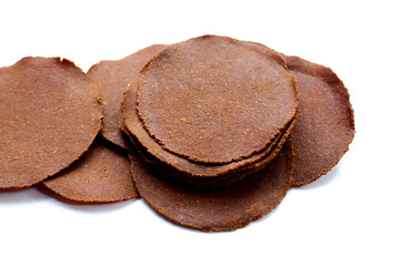 Fermented soybean discs, known as “Thua Nao,” a traditional Thai seasoning used to enhance flavor in Northern cuisine.