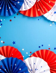Patriotic paper fans on blue background