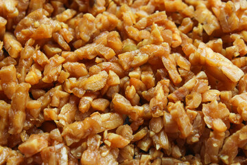 pieces of fried tempeh that are golden in color.  The texture of the soybeans is crunchy and tasty