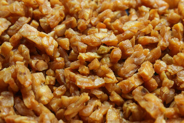 pieces of fried tempeh that are golden in color.  The texture of the soybeans is crunchy and tasty