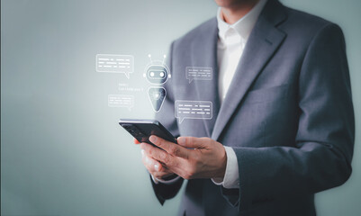 Businessman using AI chatbot application on smartphone for customer service. Interacting with a virtual assistant bot for automated conversation, online help, support. Artificial intelligence concept.