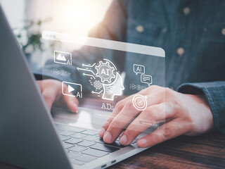 AI-powered marketing strategies, data analysis, and innovative advertising. A person using laptop, interacting with holographic show AI and Ad icons. Online media, the future of advertising.