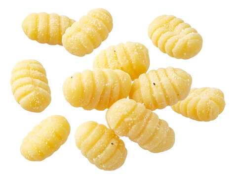 Fresh uncooked gnocchi pasta isolated, showing classic ridged texture, handmade appearance, and dusted with flour on a white background.
