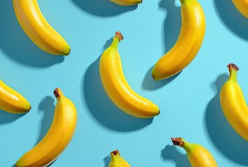 Yellow bananas arranged on bright blue