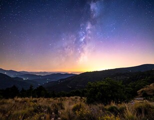 Fototapeta premium Panoramic view of a mountain landscape at dawn, with a vibrant Milky Way