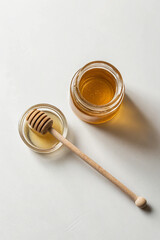 Golden honey jar and dipper wood glass