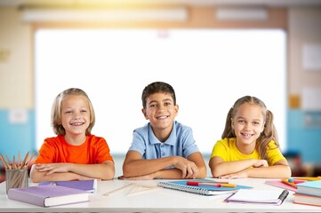 Fototapeta premium Excited little children in classroom at school