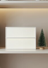 Blank Message Board: A minimalist composition features a pristine message board next to a small Christmas tree, embodying the simplicity of the festive season.