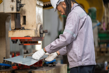 Industrial worker operating machinery manufacturing plant action shot indoor environment focused viewpoint craftsmanship in action