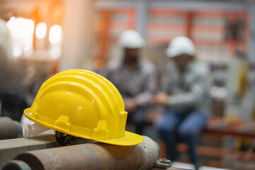 Construction safety gear yellow hard hat industrial site photography workshop close-up worker protection
