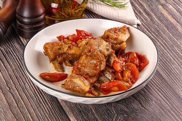 Baked lamb ribs with vegetables