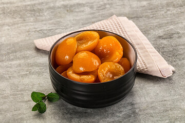 Sweet canned apricots with syrope
