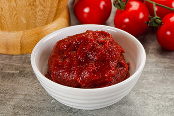 Red tomato paste in the bowl