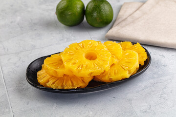 Sweet canned pineapple slices in syrope
