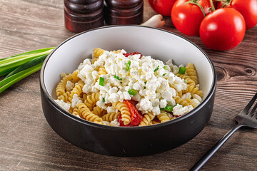 Italian pasta fusili with curd
