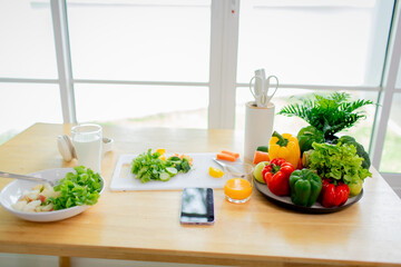 Woman enjoying fresh organic salad with lettuce, tomato, and carrot, highlighting healthy eating, vegetarian lifestyle, and balanced nutrition.
