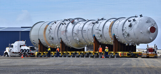 Huge refinery vessel is loaded onto a transporter multi wheeled vehicle at Barry Beach Marine Terminal, in south east Victoria.