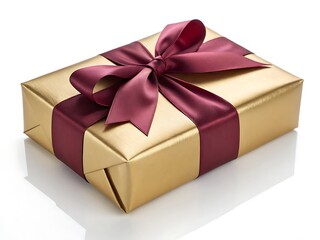Obraz premium A gold wrapped gift with a burgundy ribbon and bow sitting on a white surface in a studio setting