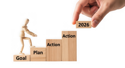 Hand placing a wooden block with 2026 on top of a staircase made of blocks labeled goal, plan, and action, isolated on transparent background