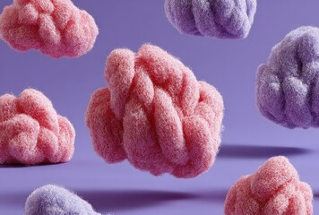Fluffy, pink and purple cloud-like shapes on purple background