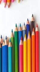 A vibrant array of colorful pencils arranged on a stark white background, creating a visual spectacle with a gradient effect from left to right
