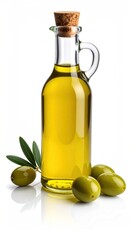 Olive oil in clear glass bottle w/ cork stopper beside green olives & a small olive branch. Glossy reflection on white surface