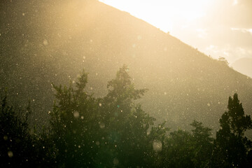 Sunlit Rainfall Over Mountain and Trees in Brazil