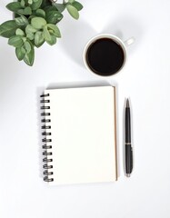 Flat lay of a spiral notebook, a cup of dark coffee, a pen, and a small potted plant on a clean, white background